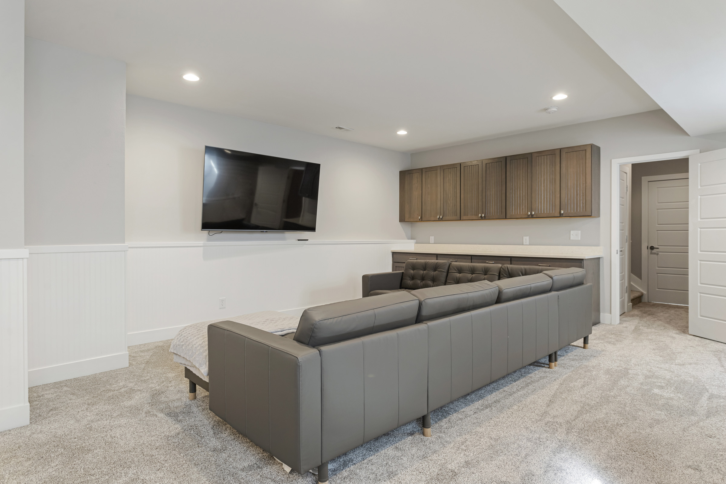 Basement media room with built-in bar