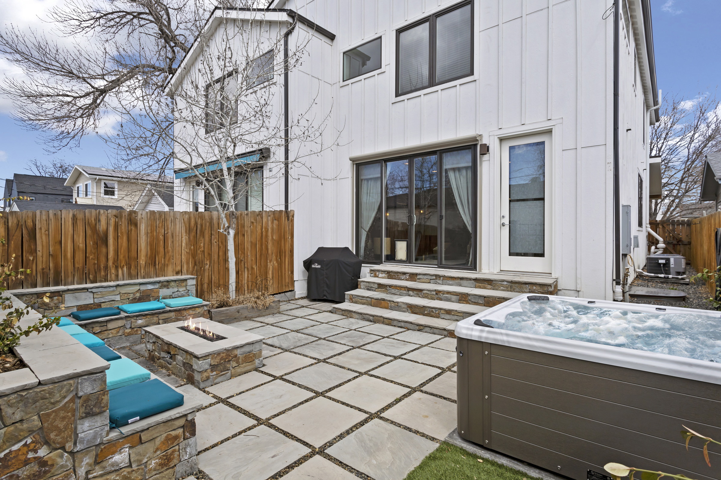 Private backyard with hot tub at executive retreat Denver