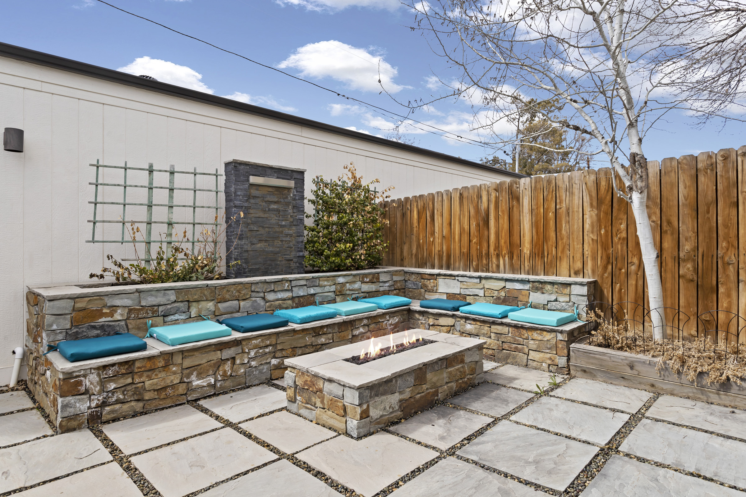 Outdoor seating area with stone fire pit