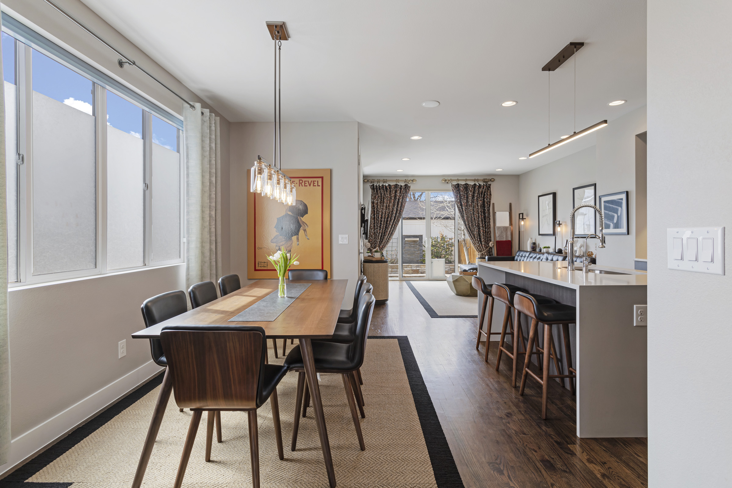 Dining and kitchen flowing to living areas